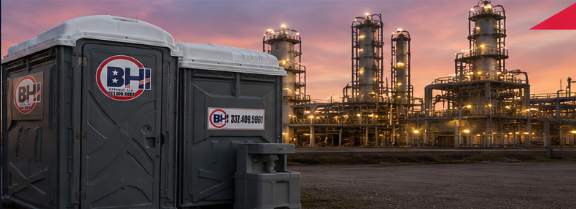 Standard and ADA portable toilets staged at a Lake Charles industrial construction site